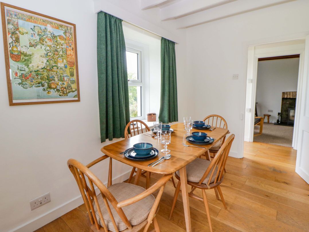 A dining room with a table set for four at Ceunant near Newport