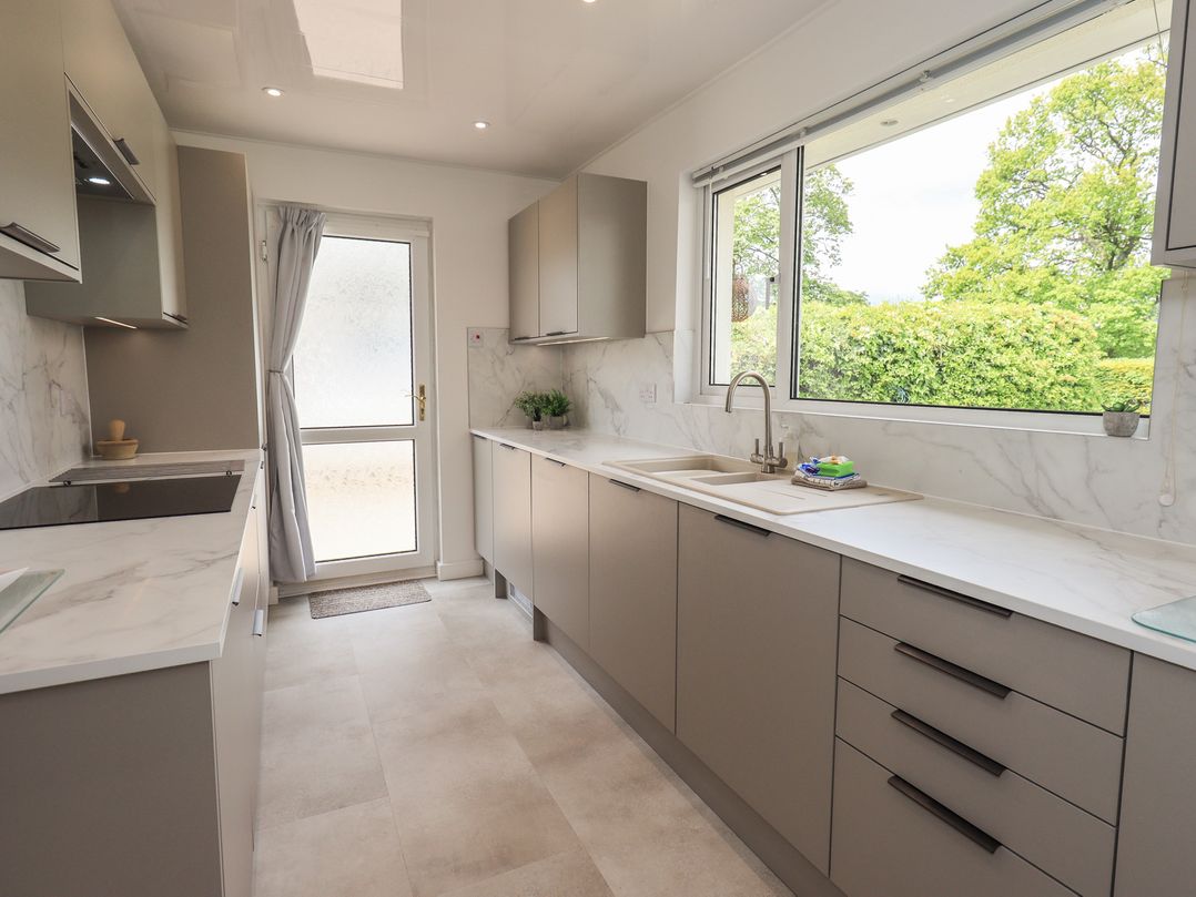 A kitchen with countertops and cabinets at Oaklea in Keswick