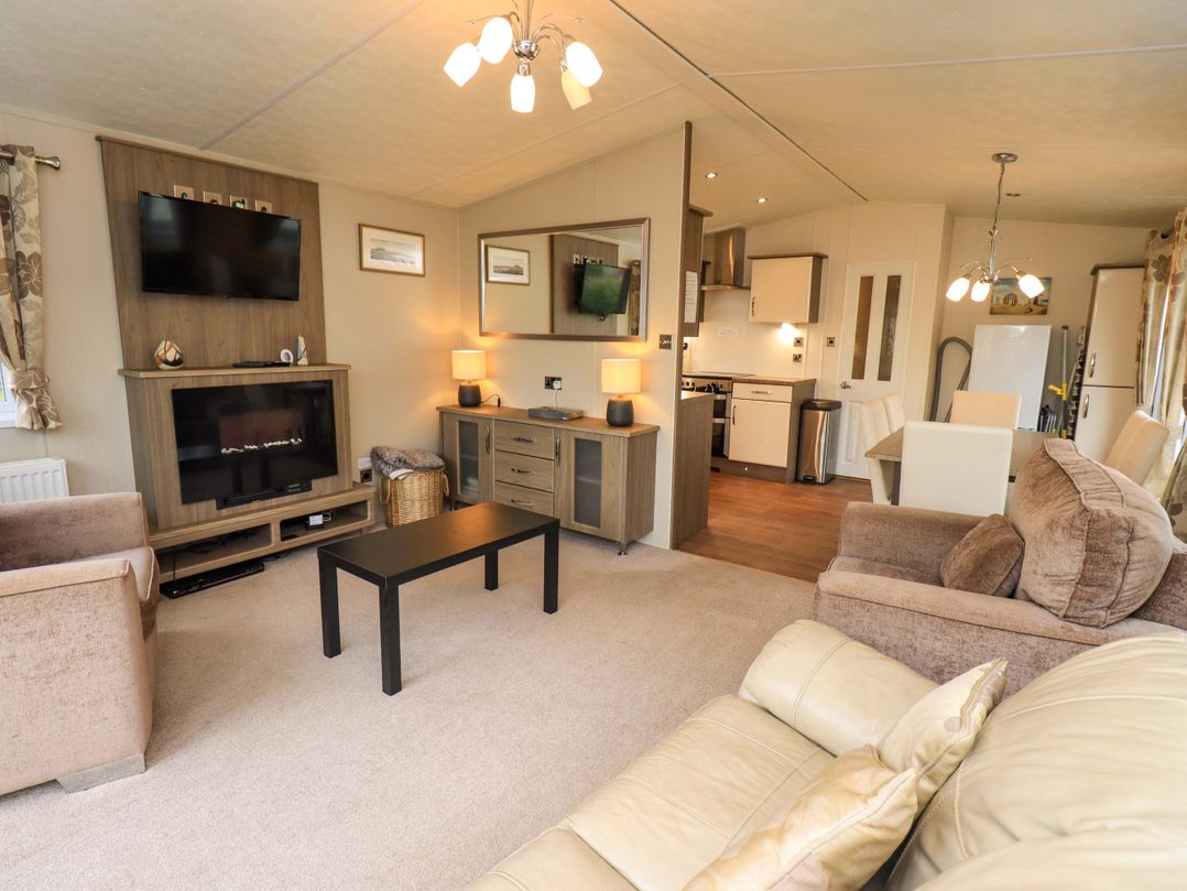 A living room with sofa and television at 41, Grandma's Cottage South Lakeland Leisure Village near Carnforth