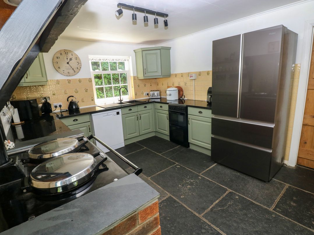 A kitchen with a refrigerator and oven at Glas y Dorlan Nevern near Newport, Pembrokeshire