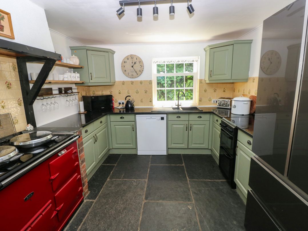 A kitchen with appliances and cabinets at Glas y Dorlan Nevern near Newport, Pembrokeshire