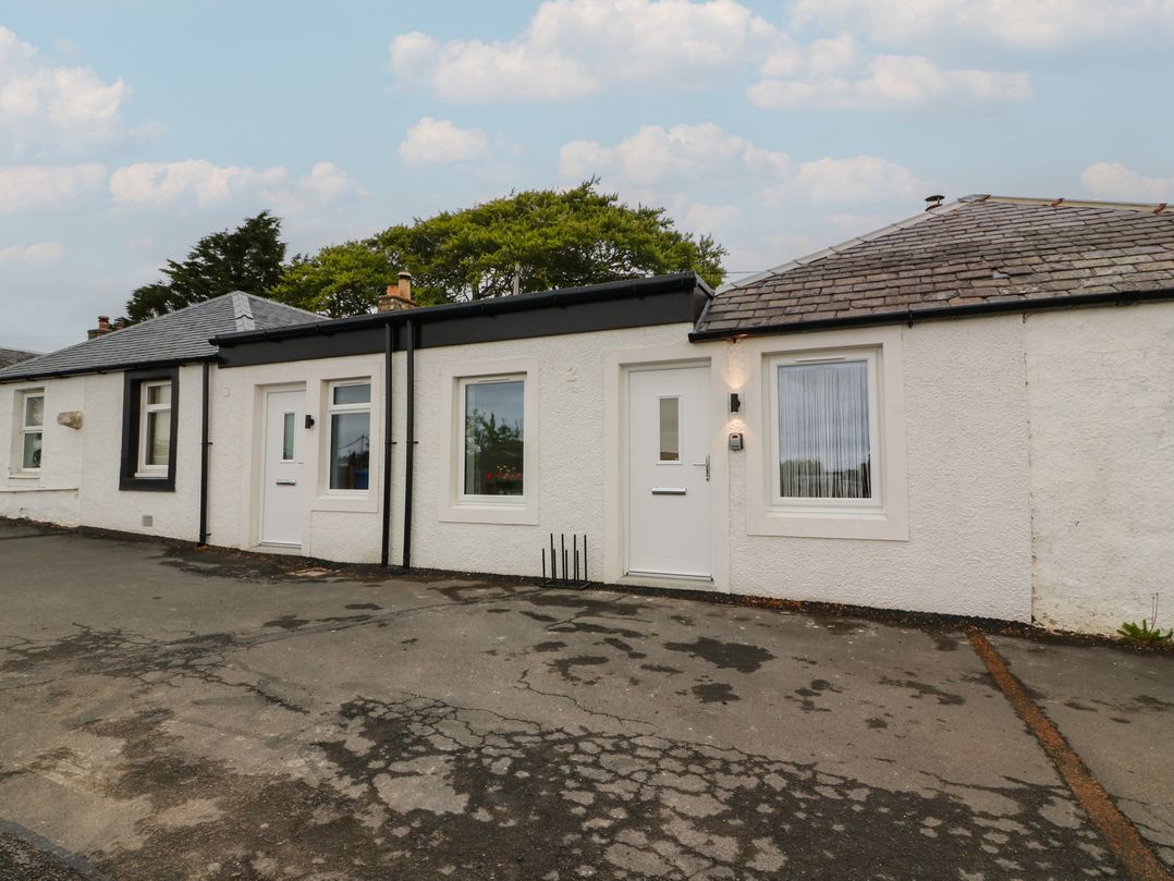 A cottage with front door and windows at Rosalin Cottage Dreghorn near Irvine