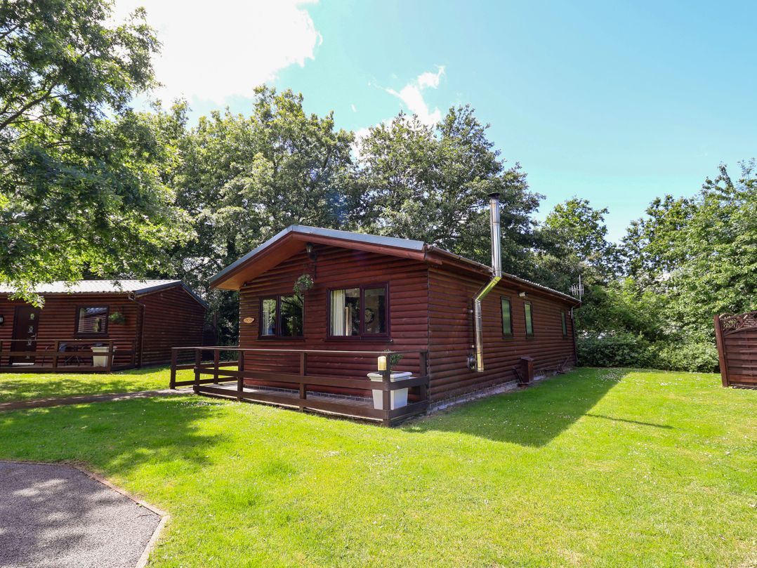 A log cabin view outside at The Red in Llanerch Park near St Asaph