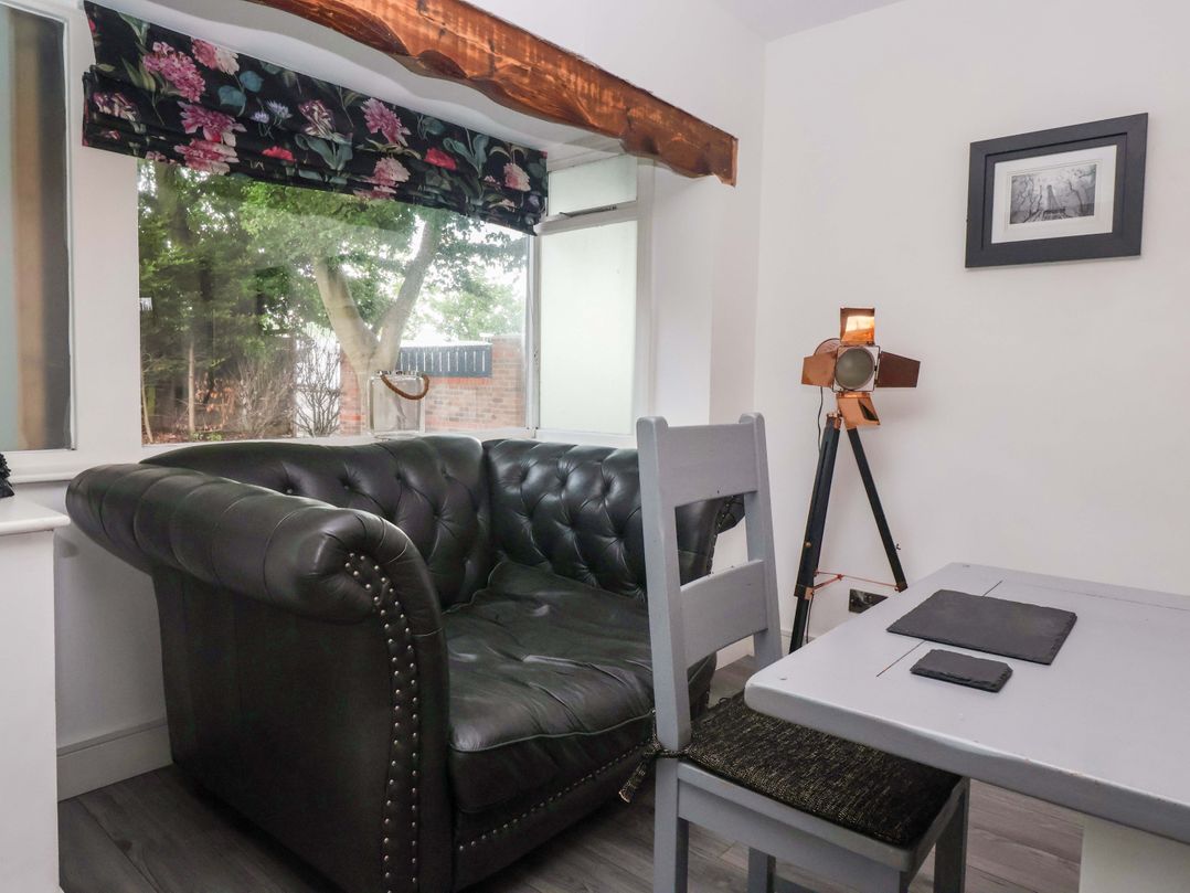 A living room with a sofa and table at Fox Retreat in Sherburn