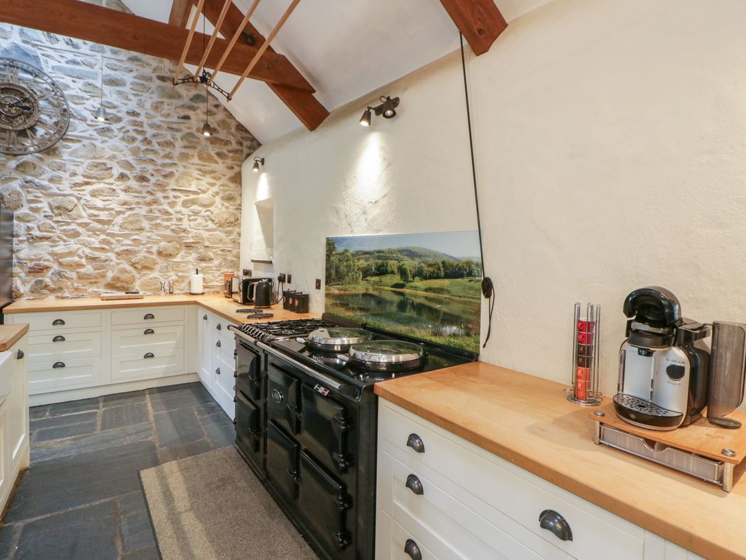A kitchen with an oven and coffee maker at St Dogwells Barn near Wolfscastle