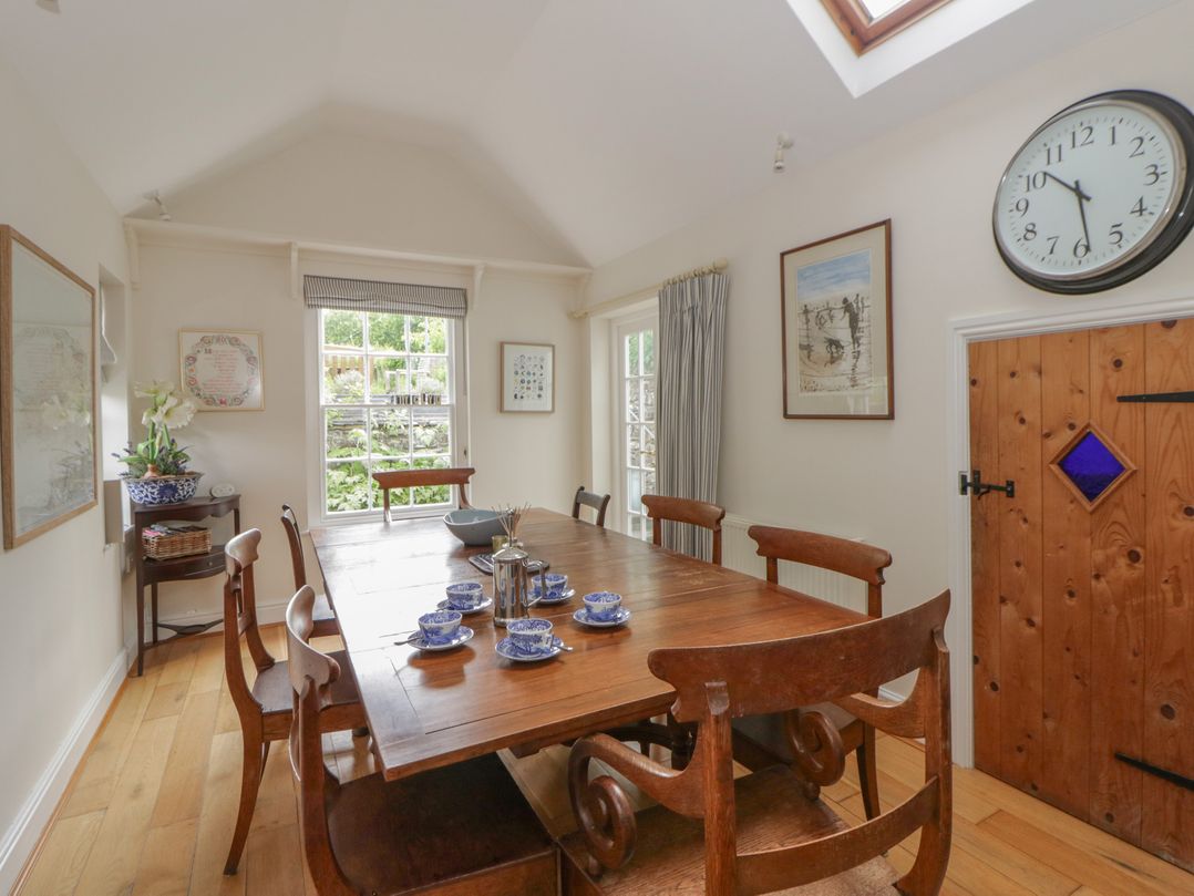 A dining room with a table and chairs at Ty Clyd in Newport, Pembrokeshire