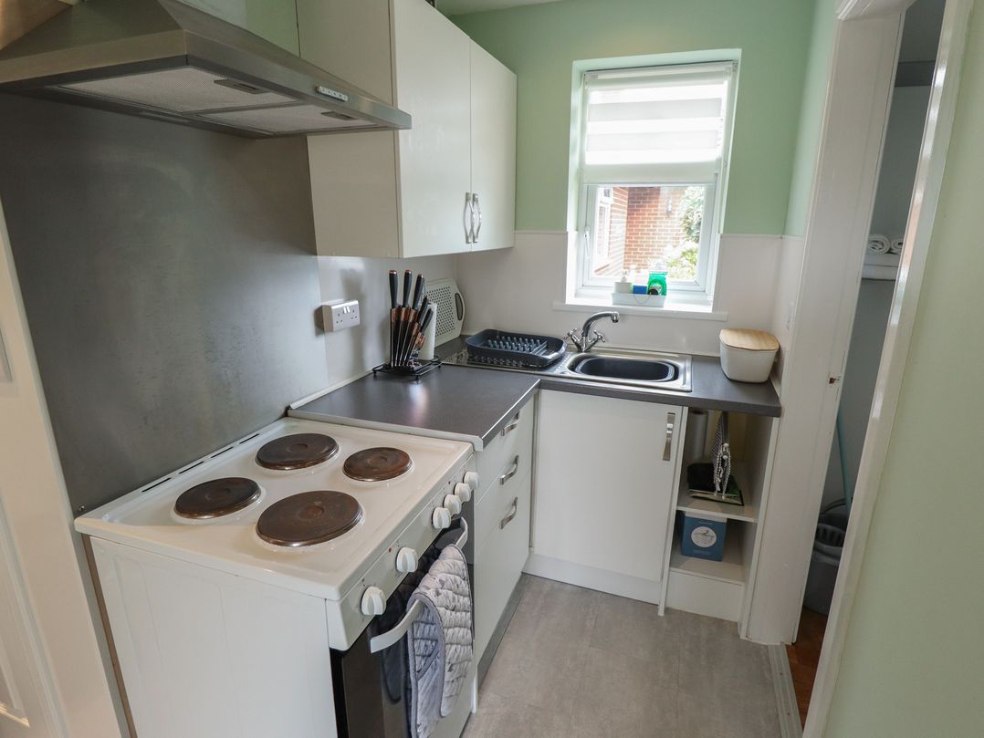 A kitchen with a stove and sink at Southfields Annex Little Carlton near Louth