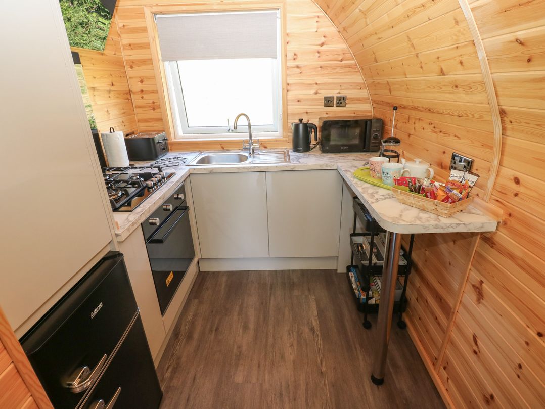 A kitchen with a sink and appliances at Lodge 2 near Pontyates