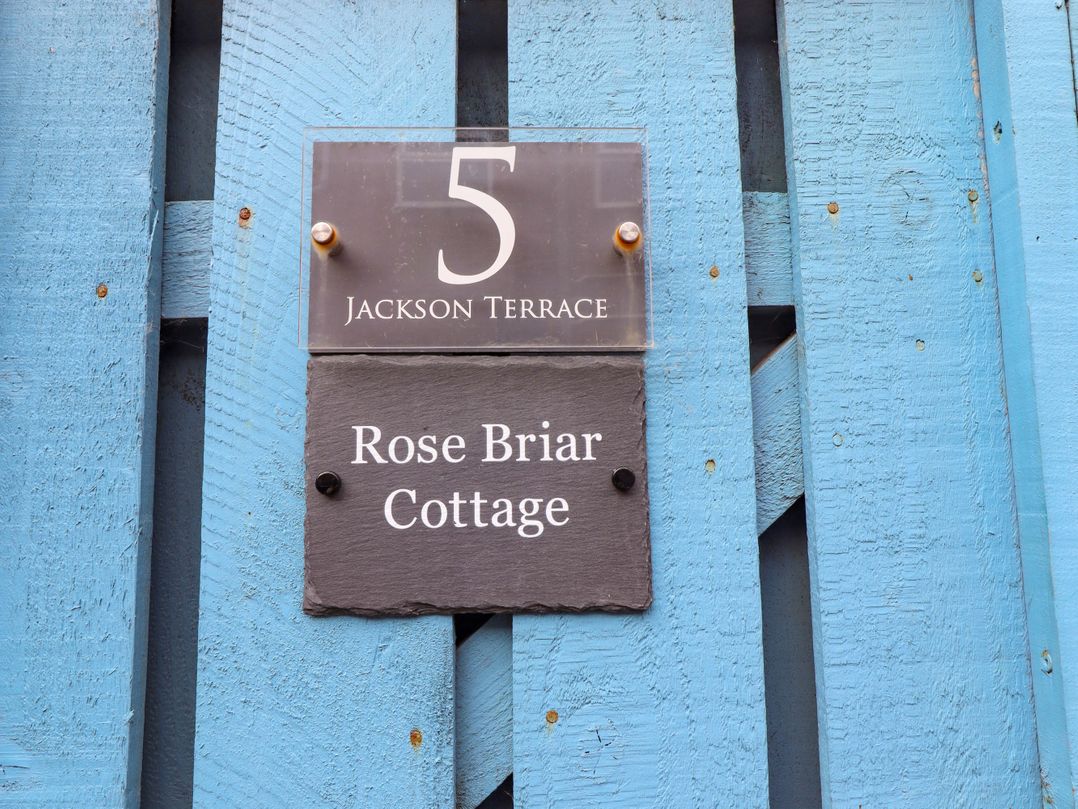A sign indicating Rose Briar Cottage at 5 Jackson Terrace