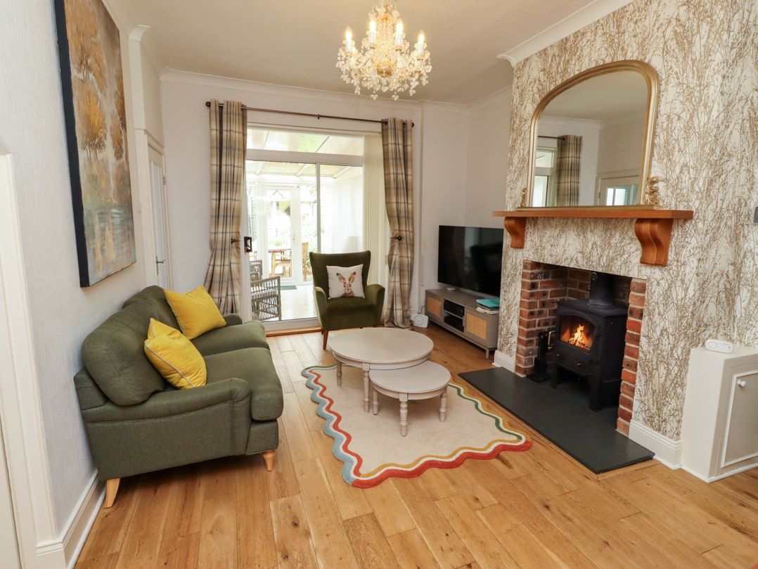 A living room with a sofa and coffee table at Rose Briar Cottage Morpeth