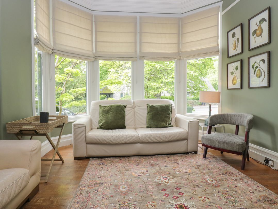 A living room with a sofa and a chair at The Boundary in Windermere