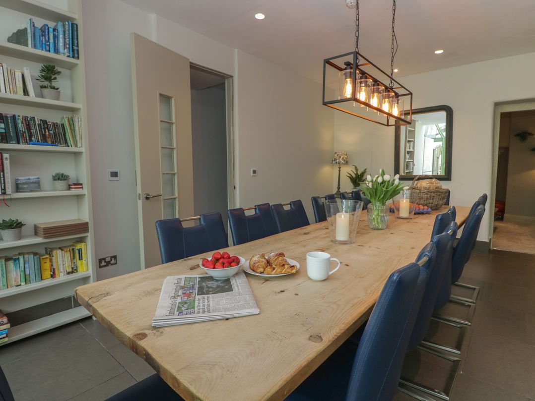 A dining room with a large table and chairs at The Boundary in Windermere