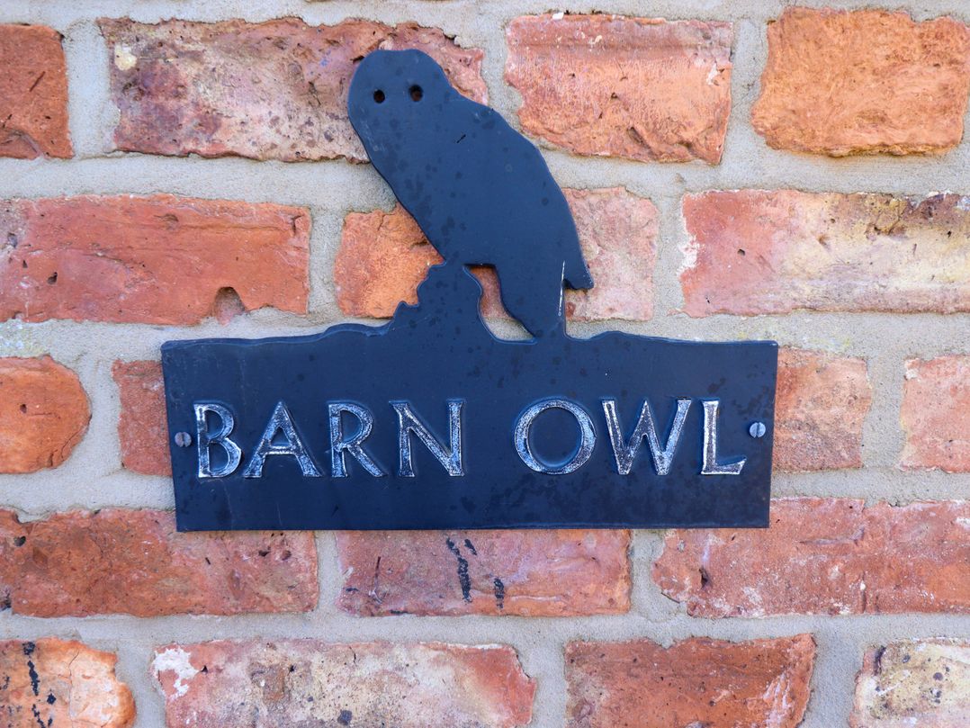 A sign with the text Barn Owl and an owl silhouette at Barn Owl near Louth