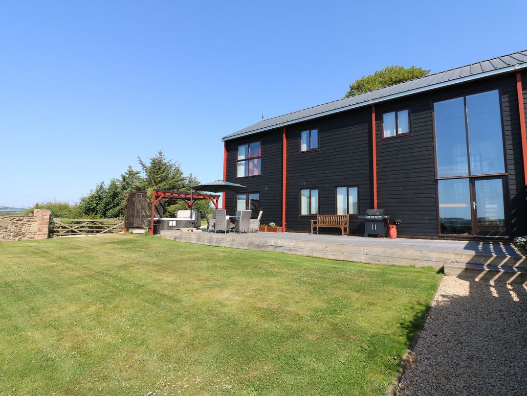 A house with a patio and garden at High Church Hill in Witton Gilbert