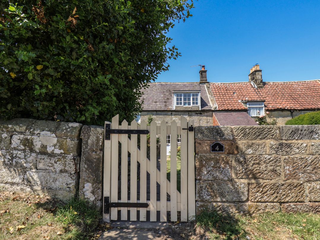 A gate leading to a house at 4 Lilac Cottages in Ainthorpe