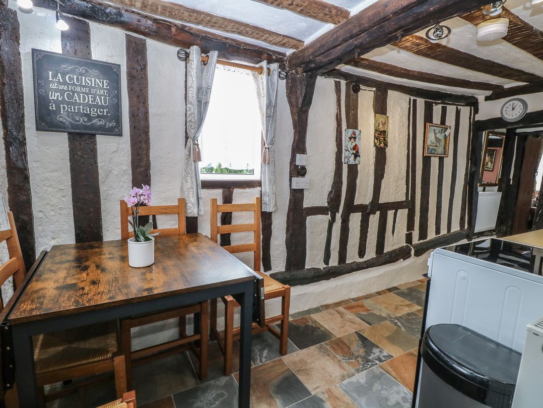A kitchen with a wooden table and chairs at Driftway Stables Retreat, Diss