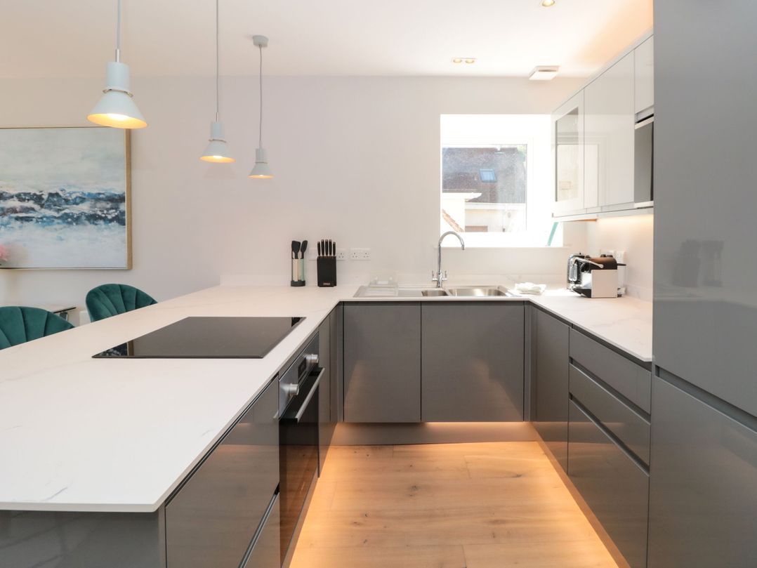 A kitchen with modern appliances and a sink at Galvayne in Dartmouth