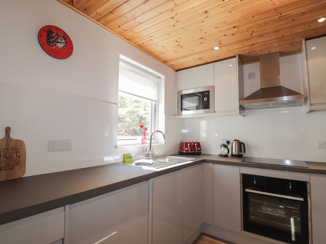 A kitchen with a sink and microwave at Tigh a Phailean in Letterfearn
