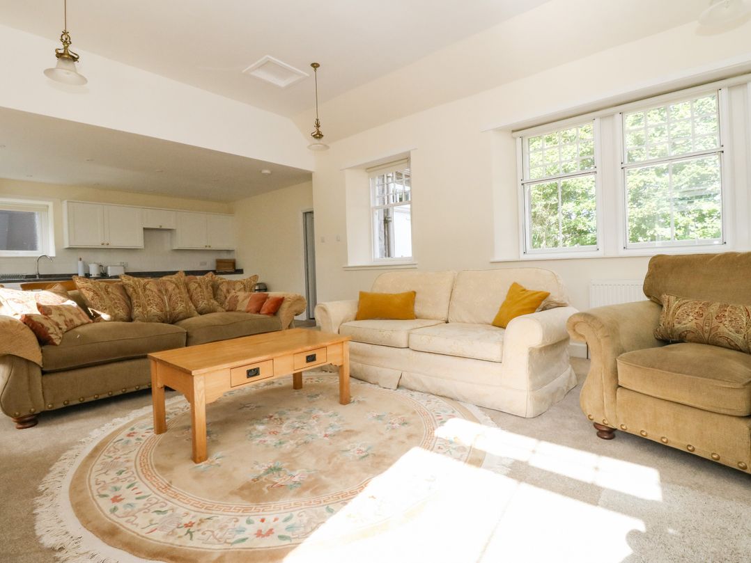 A living room with sofas and a coffee table at West House in Stanley