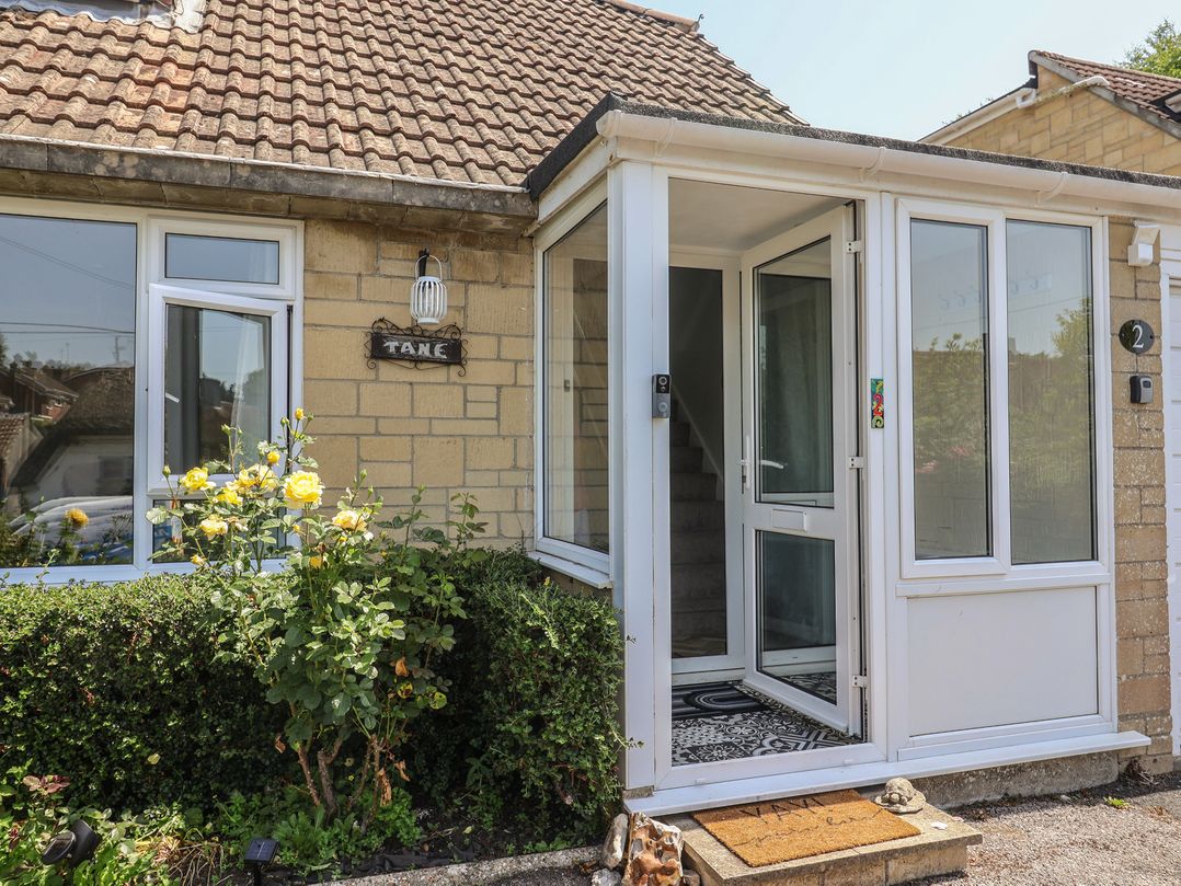 An entrance with a door and steps at Tane in Winterborne Stickland
