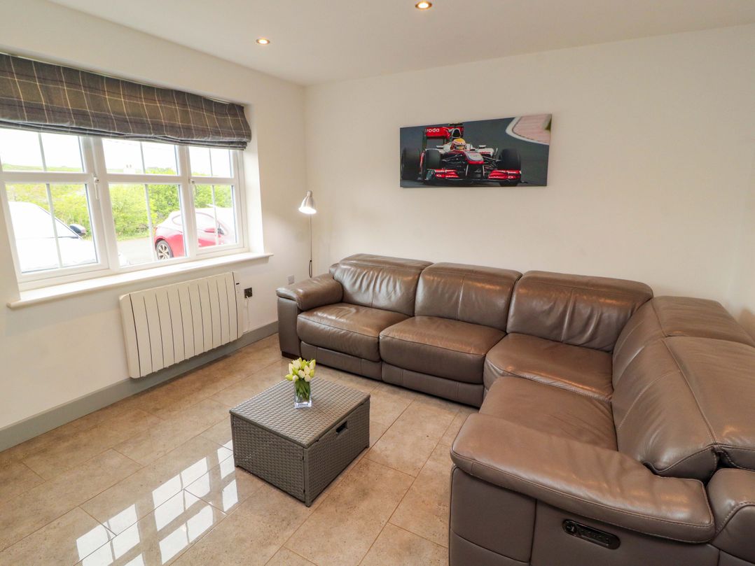 A living room with a sofa and coffee table at 11 The Forge in Brampton