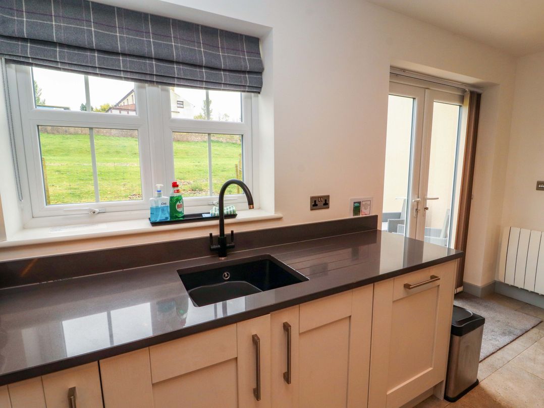 A kitchen with a sink and window at 11 The Forge Brampton