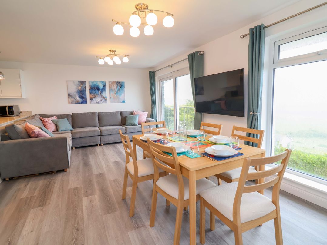 A living room and dining area with furniture at Belvedere in Woolacombe