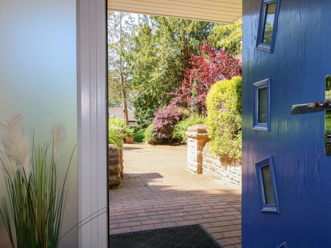 A view of a garden from an open door at Elmcroft in Nottingham