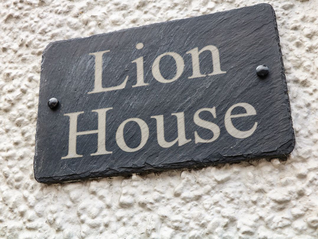 A nameplate with 'Lion House' on a wall at Lion House in Ashbourne