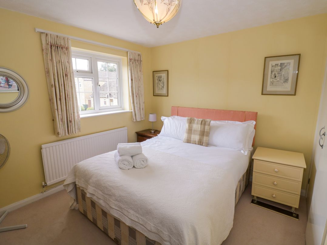 A bedroom with a bed and window at Number 10, Broadway