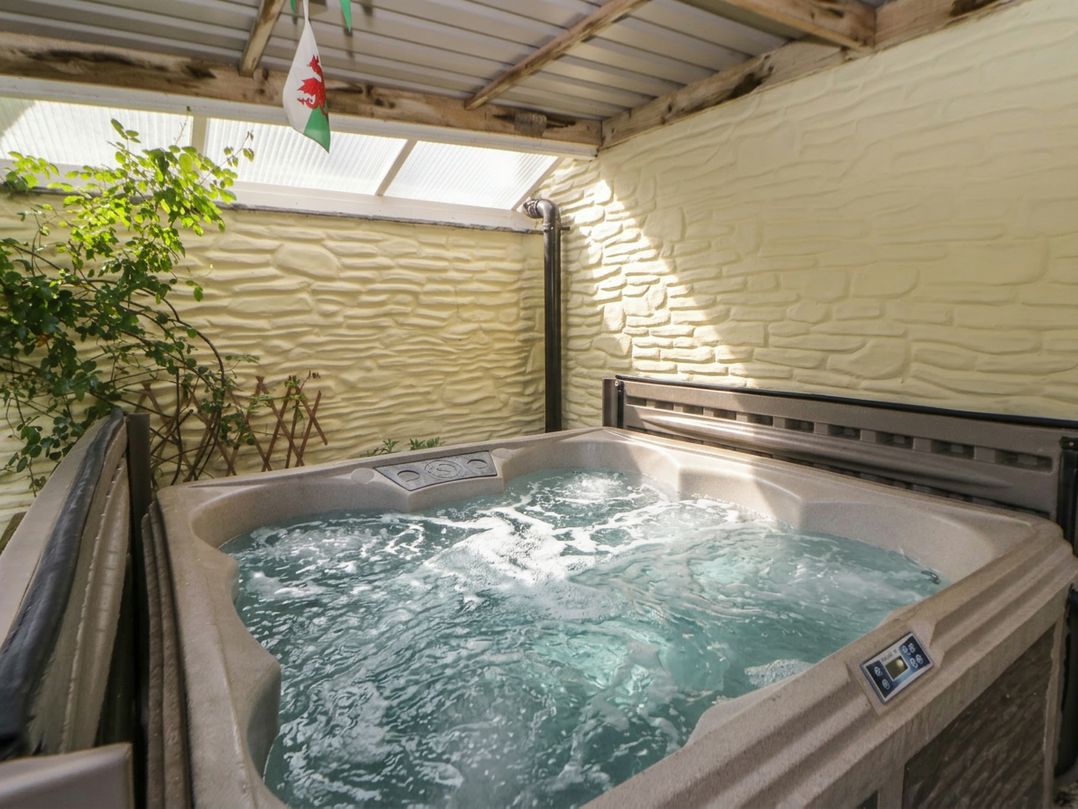 A hot tub in an indoor pool area at Yr Hen Llaethdy near Newcastle Emlyn