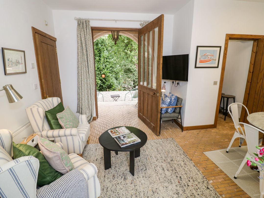 A living room with furniture and access to the garden at Diamond Lodge Ingestre near Great Haywood