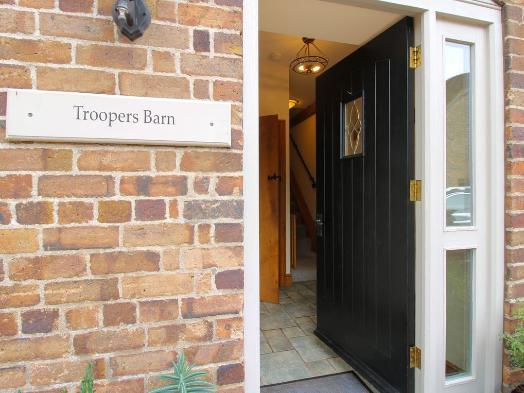 An entrance with a black front door at Trooper's Barn in Westhope