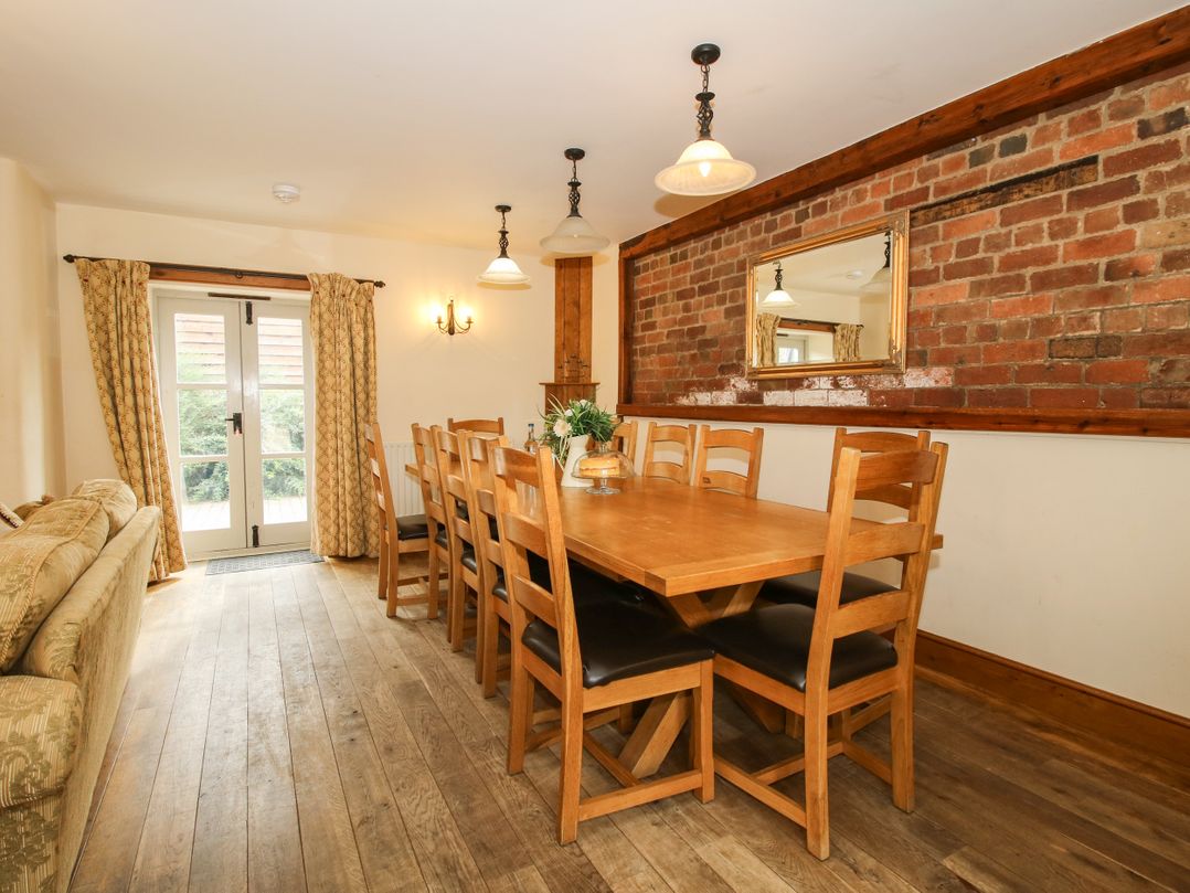A dining room with a table and chairs at Trooper's Barn Westhope