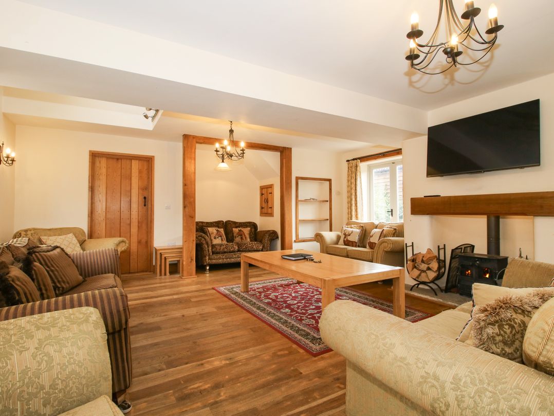 A living room with a sofa and coffee table at Trooper's Barn in Westhope