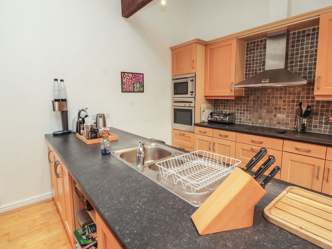 A kitchen with sink, countertops, and appliances at Winster Fields in Cartmel Fell near Windermere