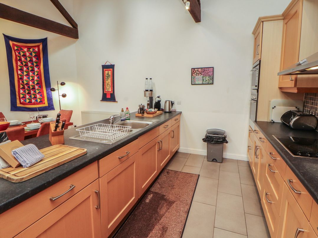 A kitchen with sink and cabinets at Winster Fields near Cartmel Fell