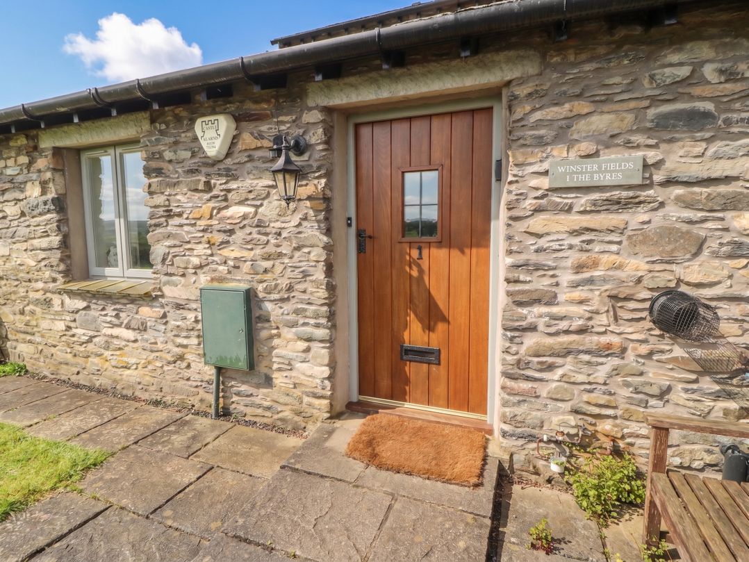 A doorway with stone wall and pathway at Winster Fields, Cartmel Fell near Windermere