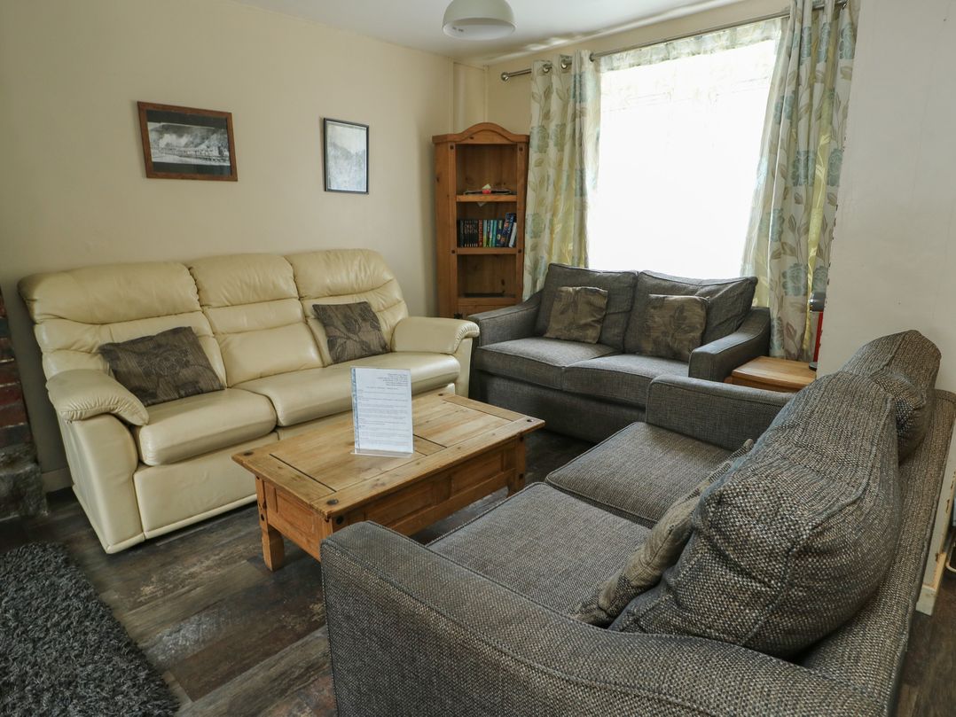 A living room with a sofa and coffee table at Halford Hill in Llanberis