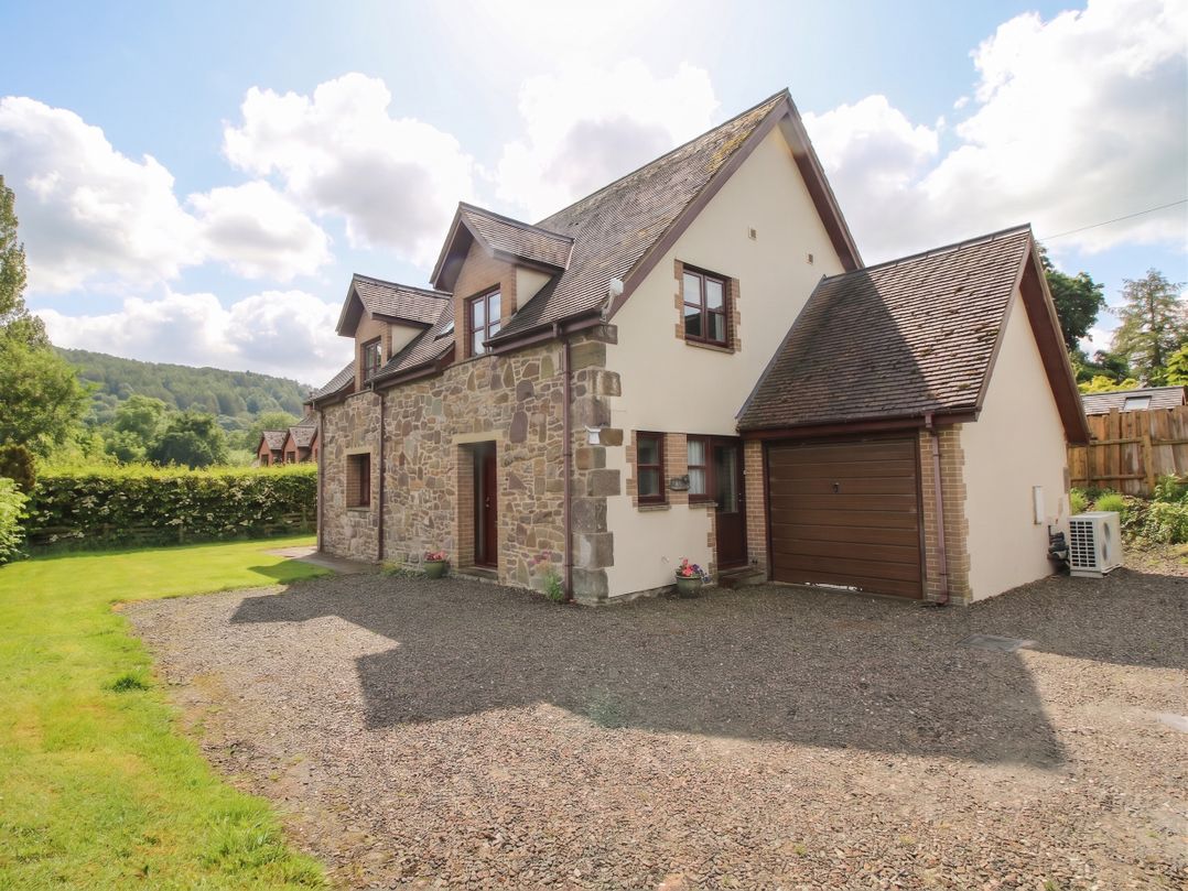 A house with a garage and garden at Byne Brook Cottage Strefford near Craven Arms