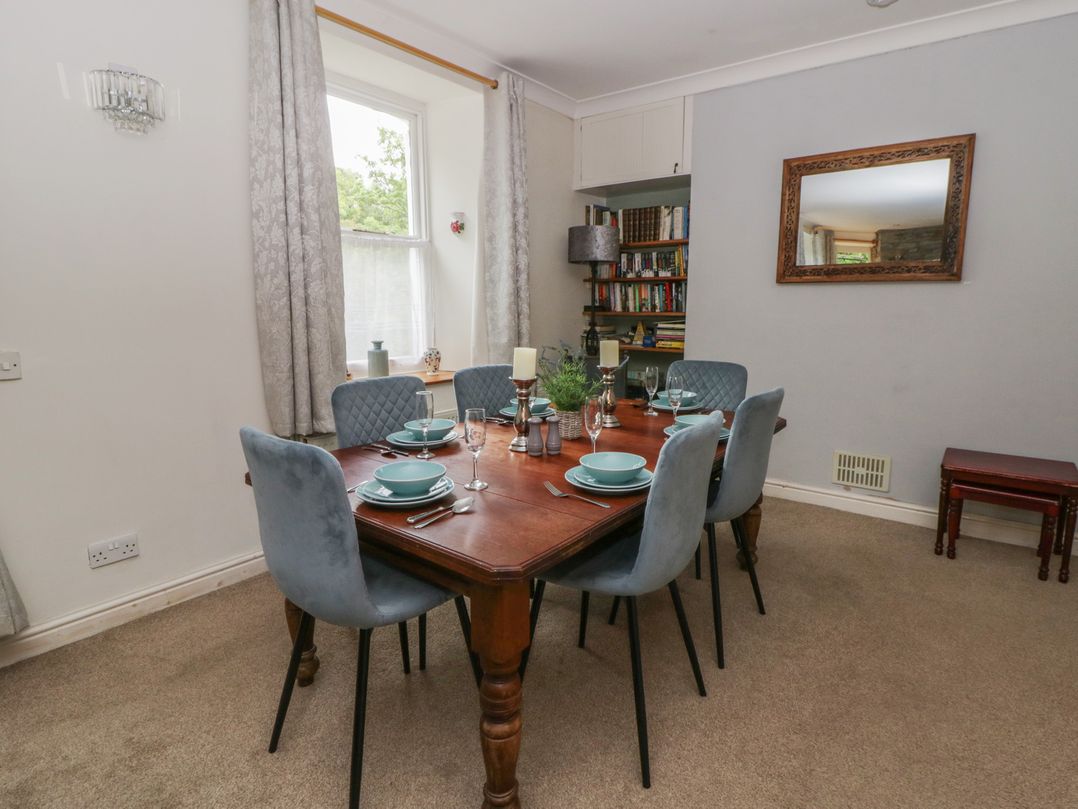 A dining room with a table set for dinner at Teifi House Cilgerran near Cardigan