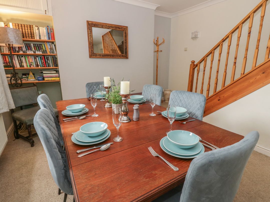 A dining room with a table set for a meal at Teifi House in Cilgerran near Cardigan
