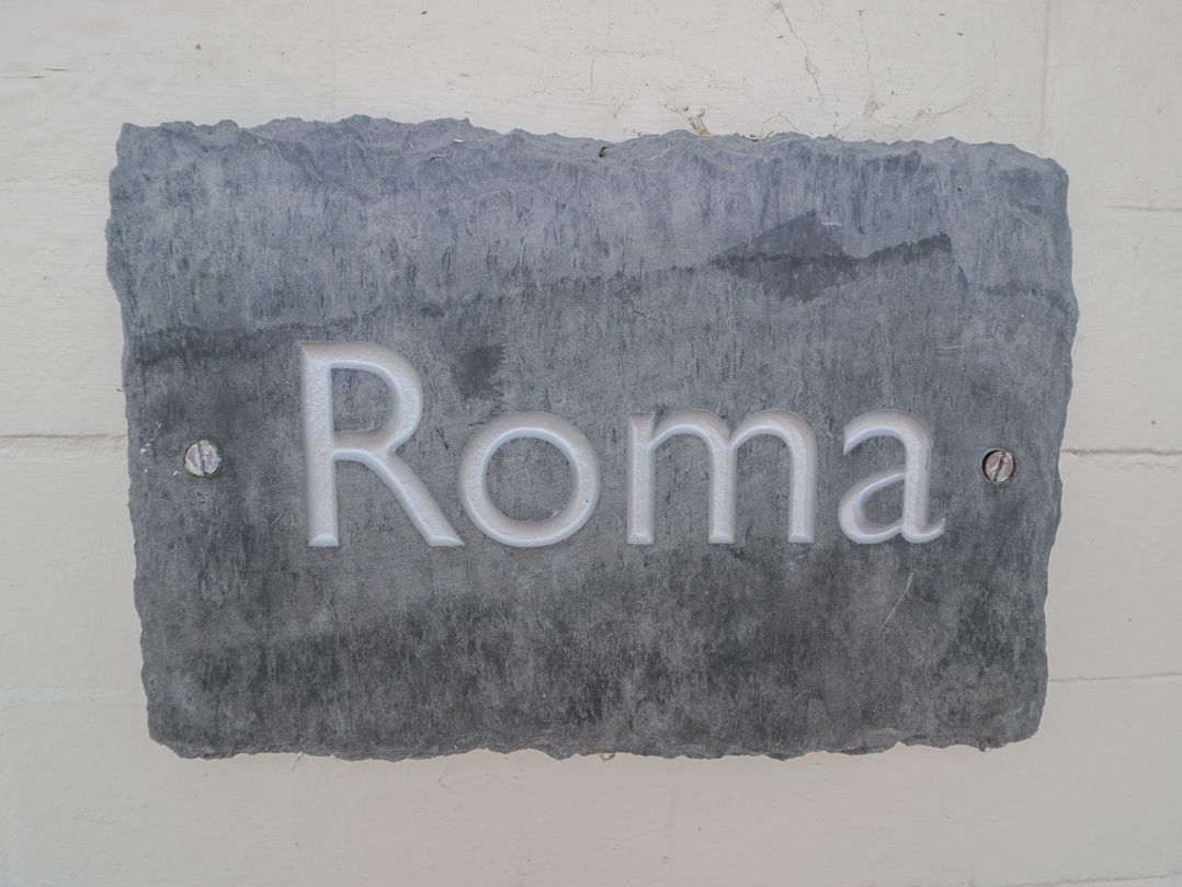 A plaque with the text Roma at Roma in Rhos-on-Sea
