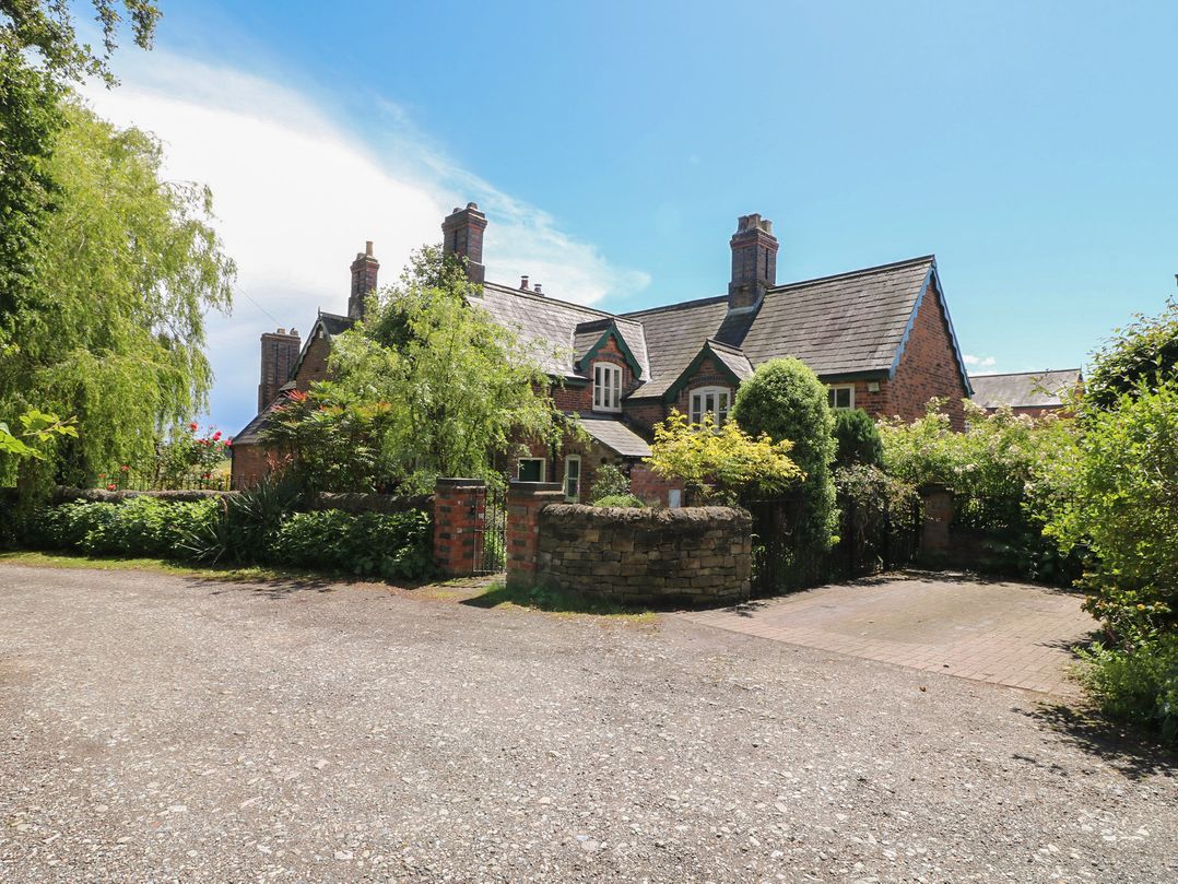 A house with a driveway and garden at Just A Cottage, Newlands Farm, Golden Valley near Riddings and Alfreton