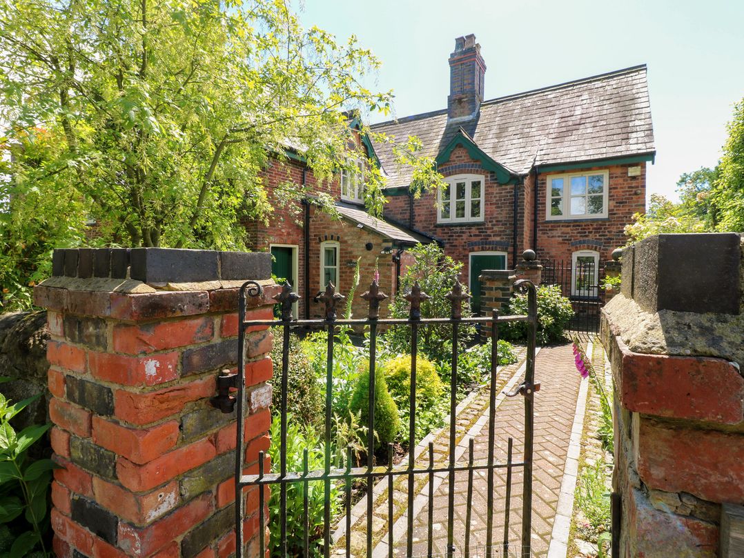 A house with a garden and gate at Just A Cottage, Newlands Farm Golden Valley near Riddings and Alfreton