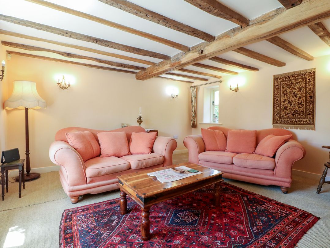A living room with two sofas and a coffee table at Just A Cottage, Newlands Farm, Golden Valley near Riddings and Alfreton