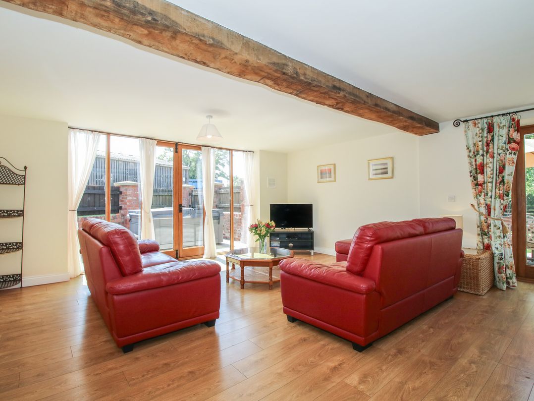 A living room with sofas and a coffee table at The Wainhouse in Bockleton near Tenbury Wells
