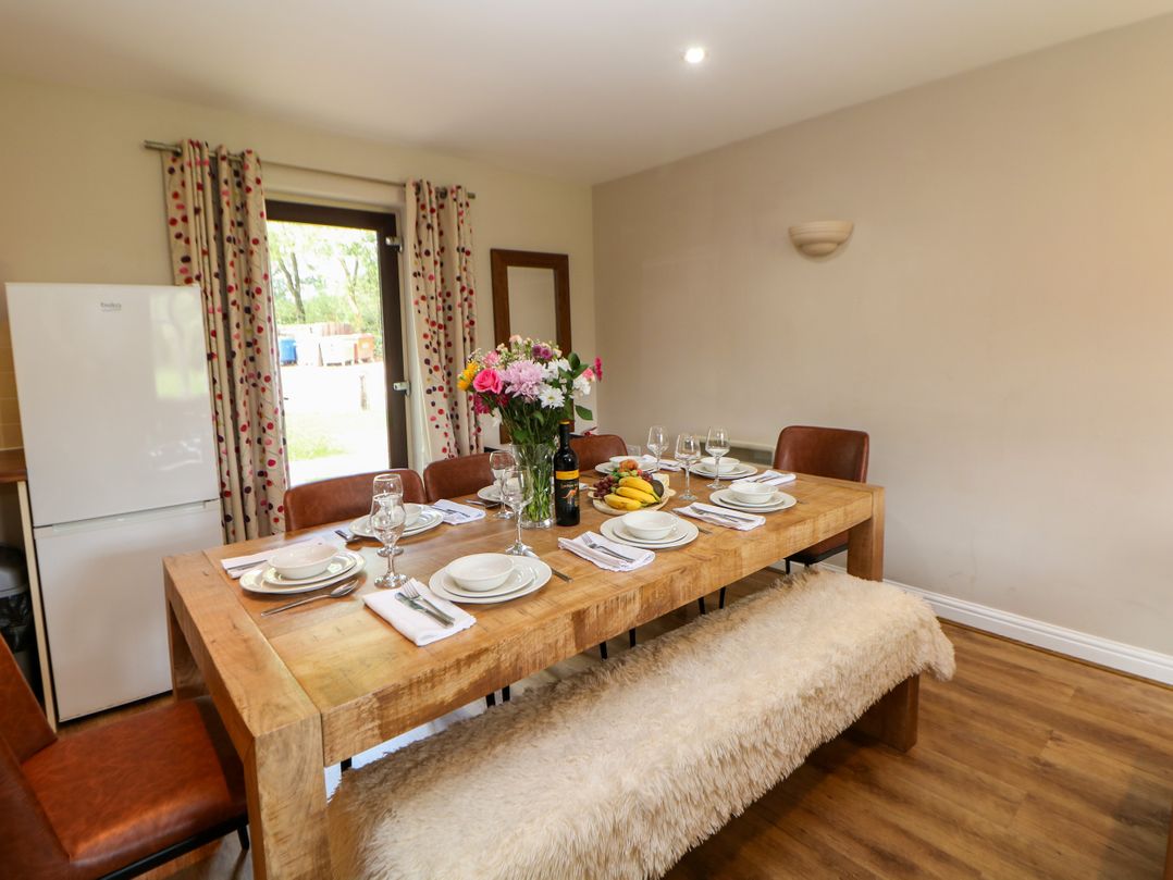 A dining room with a table set for a meal at Wensley in Matlock