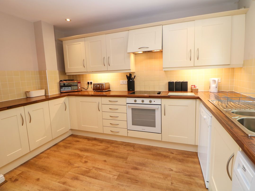A kitchen with cabinets and appliances at Wensley, Matlock