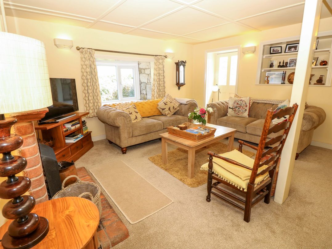 A living room with a sofa and coffee table at Sweet Briars in Chale